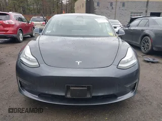 2019 Tesla Model 3 Mid Range with VIN 5YJ3E1EA3KF307415, listed as a IAAI auction lot 41673239 with 42,895 mi miles and . Bid and sale history available at DreamBid. Image 12.