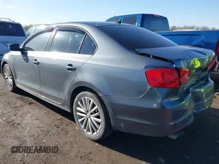 2014 Volkswagen Jetta TDI w/Premium with VIN 3VW3L7AJ9EM383295, listed as a IAAI auction lot 41983218 with 105,077 mi miles and . Bid and sale history available at DreamBid. Image 3.