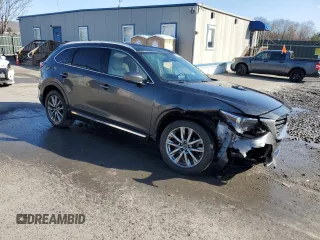 2019 Mazda CX-9 Grand Touring with VIN JM3TCBDY3K0336929, listed as a Copart auction lot 52980005 with 70,878 mi miles and Salvage title. Bid and sale history available at DreamBid. Image 4.