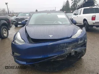 2022 Tesla Model 3 Long Range with VIN 5YJ3E1EB1NF142574, listed as a IAAI auction lot 41213900 with 127,404 mi miles and . Bid and sale history available at DreamBid. Image 12.