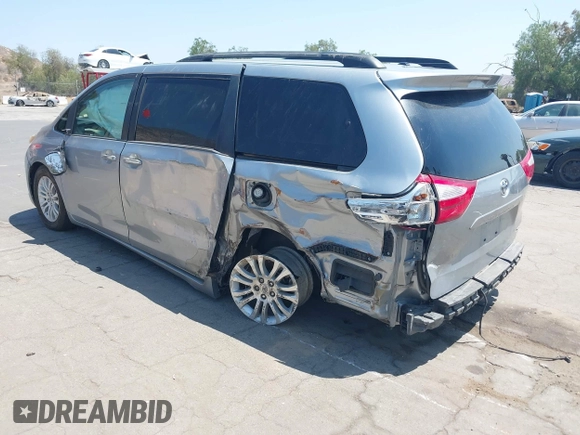 2015 Toyota Sienna XLE with VIN 5TDYK3DC0FS589947, listed as a IAAI auction lot 36567379 with 130,969 mi miles and . Bid and sale history available at DreamBid. Image 3.