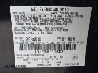 2013 Ford Taurus SEL with VIN 1FAHP2E86DG135835, listed as a IAAI auction lot 41665430 with 130,816 mi miles. Bid and sale history available at carsss.com. Image 9.