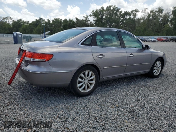 2007 Hyundai Azera SE with VIN KMHFC46FX7A216846, listed as a Copart auction lot 60035695 with 197,201 mi miles and Salvage title. Bid and sale history available at DreamBid. Image 3.