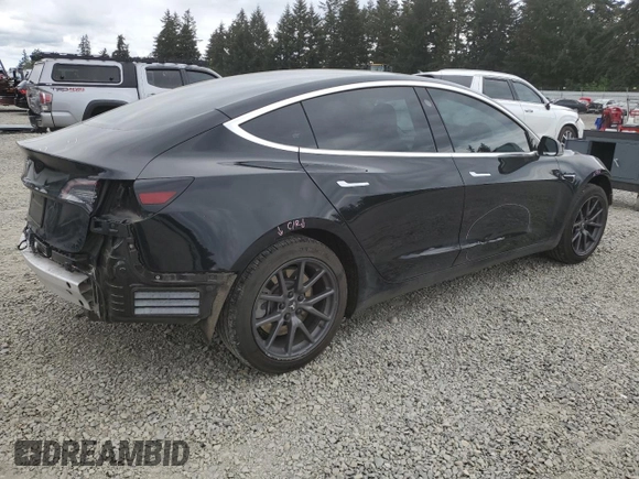 2019 Tesla Model 3 Mid Range z VIN 5YJ3E1EAXKF422500, wystawiony jako Copart lot #56065665 z przebiegiem 72 781 mil mil oraz Szkoda całkowita • Salvage title. Historia ofert i sprzedaży dostępna na DreamBid. Obrazek 3.