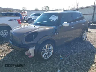 2014 MINI Countryman S with VIN WMWZC3C5XEWP52054, listed as a IAAI auction lot 41452354 with 104,873 mi miles and . Bid and sale history available at DreamBid. Image 18.