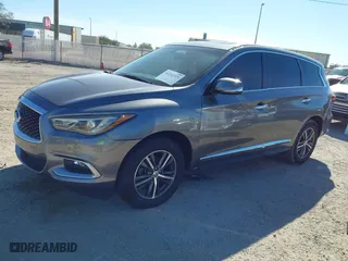 2016 Infiniti QX60 with VIN 5N1AL0MN5GC502797, listed as a IAAI auction lot 41242329 with 212,317 mi miles. Bid and sale history available at carsss.com. Image 2.