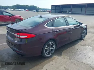 2017 Ford Fusion Titanium z VIN 3FA6P0K94HR271307, wystawiony jako IAAI lot #42595411 z przebiegiem 100 344 mil mil oraz . Historia ofert i sprzedaży dostępna na DreamBid. Obrazek 4.