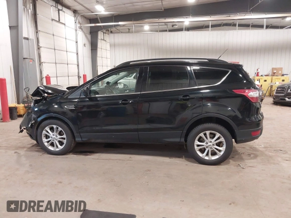 2017 Ford Escape SE with VIN 1FMCU9G98HUD67920, listed as a IAAI auction lot 40937291 with 124,302 mi miles. Bid and sale history available at carsss.com. Image 14.