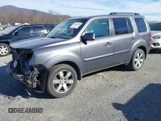 2014 Honda Pilot Touring with VIN 5FNYF4H95EB019048, listed as a IAAI auction lot 41526958 with 172,252 mi miles and . Bid and sale history available at DreamBid. Image 20.