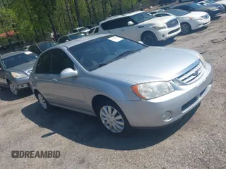 2004 Kia Spectra LX with VIN KNAFE122145037581, listed as a IAAI auction lot 41965681 with 49,817 mi miles. Bid and sale history available at carsss.com. Image 1.