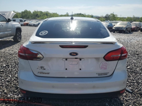 2016 Ford Focus Titanium z VIN 1FADP3J25GL201003, wystawiony jako Copart lot #53799745 z przebiegiem 194 055 mil mil oraz Szkoda całkowita • Salvage title. Historia ofert i sprzedaży dostępna na DreamBid. Obrazek 6.