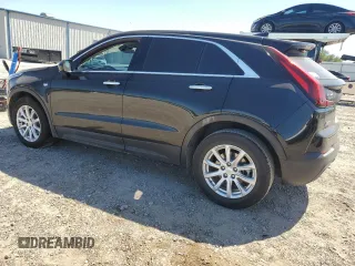 2023 Cadillac XT4 FWD Luxury z VIN 1GYAZAR46PF178003, wystawiony jako Copart lot #52024665 z przebiegiem 42 000 mil mil oraz Szkoda całkowita • Salvage title. Historia ofert i sprzedaży dostępna na DreamBid. Obrazek 2.