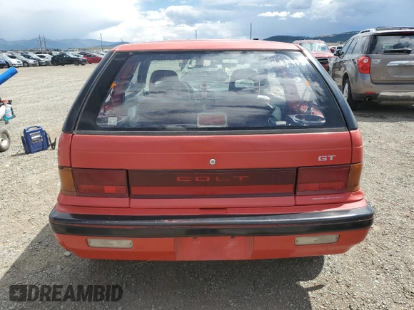 1989 Plymouth Colt GT z VIN JP3CU34X7KU085019, wystawiony jako Copart lot #61891764 z przebiegiem 188 465 mil mil oraz Czysty tytuł • Clean title. Historia ofert i sprzedaży dostępna na DreamBid. Obrazek 6.