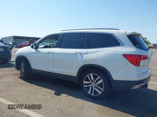 2018 Honda Pilot Touring with VIN 5FNYF6H95JB019122, listed as a IAAI auction lot 42439283 with 128,848 mi miles and . Bid and sale history available at DreamBid. Image 14.