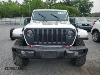 2023 Jeep Wrangler Rubicon with VIN 1C4JJXFM3PW585720, listed as a Copart auction lot 59776305 with 19,190 mi miles and Salvage title. Bid and sale history available at DreamBid. Image 5.