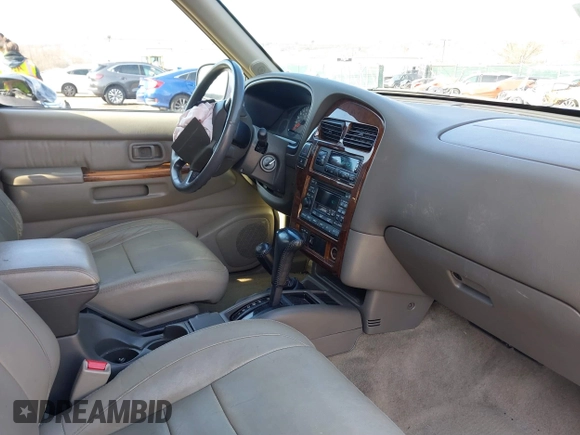 1998 Infiniti QX4 with VIN JNRAR05Y0WW027570, listed as a IAAI auction lot 41882870 with 147,639 mi miles and . Bid and sale history available at DreamBid. Image 5.