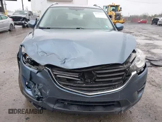 2016 Mazda CX-5 Sport with VIN JM3KE4BY5G0727608, listed as a IAAI auction lot 41975279 with 95,817 mi miles and . Bid and sale history available at carsss.com. Image 12.