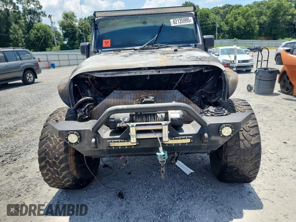 2007 Jeep Wrangler Unlimited Sahara с VIN 1J4GA59167L183198, выставлен на аукционе Copart как лот 62135995 с пробегом Не указан миль и Списание • Salvage title. История ставок и продаж доступна на DreamBid. Изображение 5.