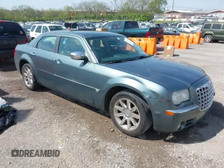 2006 Chrysler 300 C with VIN 2C3KA63H76H141246, listed as a IAAI auction lot 42035339 with 208,798 mi miles. Bid and sale history available at carsss.com. Image 1.