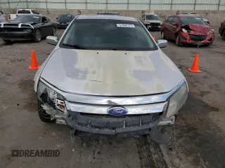 2012 Ford Fusion SEL with VIN 3FAHP0JG7CR257418, listed as a Copart auction lot 61842175 with 167,669 mi miles and Salvage title. Bid and sale history available at DreamBid. Image 5.