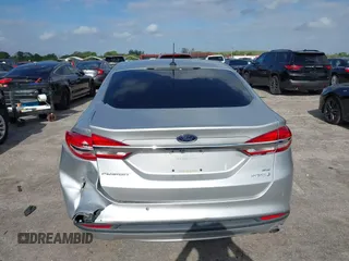 2018 Ford Fusion SE z VIN 3FA6P0LU2JR281231, wystawiony jako IAAI lot #41963083 z przebiegiem 115 434 mil mil oraz . Historia ofert i sprzedaży dostępna na DreamBid. Obrazek 16.