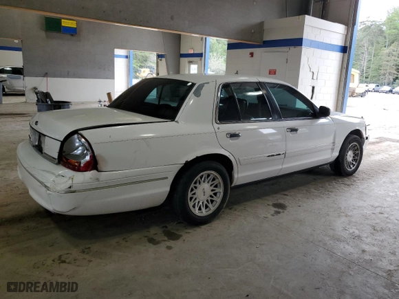 2003 Ford Crown Victoria LX with VIN 2FAFP74W23X134274, listed as a Copart auction lot 73295754 with 212,581 mi miles and Salvage Title. Bid and sale history available at carsss.com. Image 3.