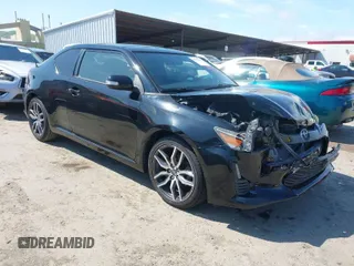 2015 Scion tC with VIN JTKJF5C79F3093271, listed as a IAAI auction lot 41870684 with 153,623 mi miles. Bid and sale history available at carsss.com. Image 1.
