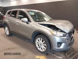 2014 Mazda CX-5 Grand Touring with VIN JM3KE4DY9E0373974, listed as a IAAI auction lot 42073693 with 86,755 mi miles. Bid and sale history available at carsss.com. Image 1.