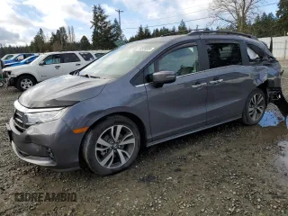 2021 Honda Odyssey Touring with VIN 5FNRL6H87MB033970, listed as a Copart auction lot 48928895 with 52,287 mi miles and Salvage Title. Bid and sale history available at carsss.com. Image 1.