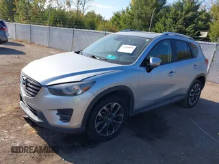 2016 Mazda CX-5 Grand Touring z VIN JM3KE2DY3G0712249, wystawiony jako IAAI lot #37910910 z przebiegiem 262 058 mil mil oraz . Historia ofert i sprzedaży dostępna na DreamBid. Obrazek 2.