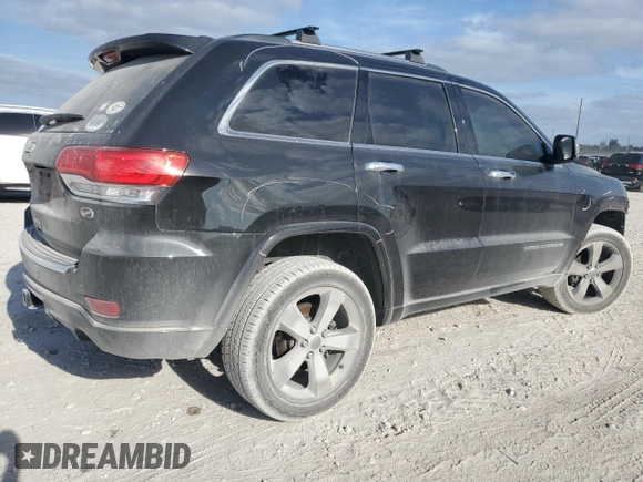 2015 Jeep Grand Cherokee Overland with VIN 1C4RJFCG6FC919637, listed as a Copart auction lot 52072925 with 111,552 mi miles and Salvage Title. Bid and sale history available at carsss.com. Image 3.