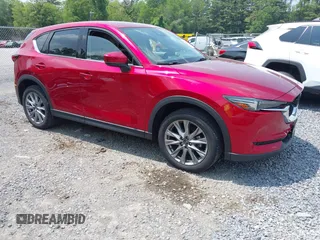 2021 Mazda CX-5 Grand Touring with VIN JM3KFBDM3M0434569, listed as a IAAI auction lot 42422349 with 25,924 mi miles and . Bid and sale history available at DreamBid. Image 1.