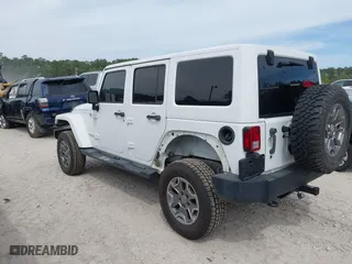 2015 Jeep Wrangler Unlimited Rubicon Hard Rock with VIN 1C4HJWFG7FL684057, listed as a IAAI auction lot 41963885 with 103,240 mi miles. Bid and sale history available at carsss.com. Image 3.