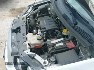 2014 Chevrolet Sonic LT z VIN 1G1JC5SB6E4213700, wystawiony jako IAAI lot #42663002 z przebiegiem 100 076 mil mil oraz . Historia ofert i sprzedaży dostępna na DreamBid. Obrazek 19.