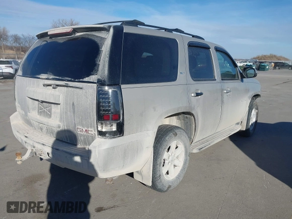 2009 GMC Yukon SLT w/4SA with VIN 1GKFK33039J117245, listed as a IAAI auction lot 41421302 with 199,864 mi miles. Bid and sale history available at carsss.com. Image 4.