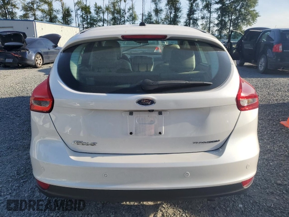 2015 Ford Focus Titanium z VIN 1FADP3N24FL262321, wystawiony jako Copart lot #59635525 z przebiegiem Nie podano mil oraz Szkoda całkowita • Salvage title. Historia ofert i sprzedaży dostępna na DreamBid. Obrazek 6.