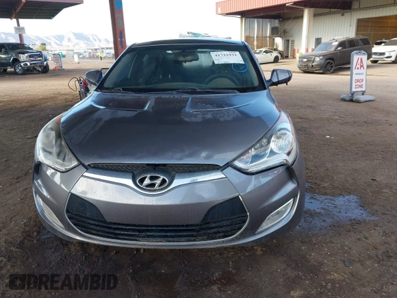2014 Hyundai Veloster RE:FLEX z VIN KMHTC6AD2EU197984, wystawiony jako IAAI lot #41721931 z przebiegiem 107 252 mil mil oraz . Historia ofert i sprzedaży dostępna na DreamBid. Obrazek 6.