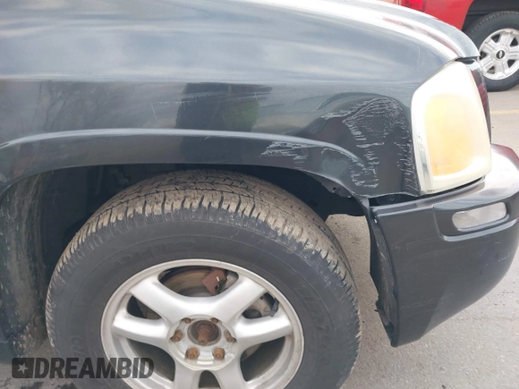 2005 GMC Envoy SLT with VIN 1GKDT13S352258833, listed as a IAAI auction lot 41525149 with 213,829 mi miles. Bid and sale history available at carsss.com. Image 6.