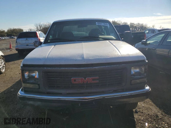 1999 GMC Sierra 1500 with VIN 1GTGC33RXXF096504, listed as a Copart auction lot 80027354 with 124,430 mi miles and Clean Title. Bid and sale history available at DreamBid. Image 5.