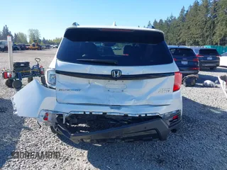2023 Honda Passport Elite with VIN 5FNYF8H01PB004087, listed as a IAAI auction lot 42045433 with 20,677 mi miles and . Bid and sale history available at carsss.com. Image 6.