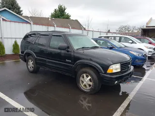 1999 Oldsmobile Bravada with VIN 1GHDT13W0X2712225, listed as a IAAI auction lot 41550117 with 170,706 mi miles. Bid and sale history available at carsss.com. Image 1.