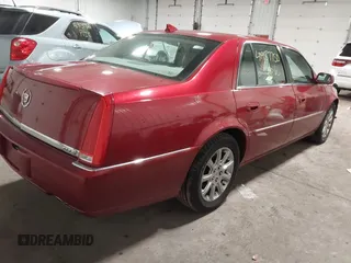 2009 Cadillac DTS w/1SA with VIN 1G6KD57Y59U149387, listed as a IAAI auction lot 41957750 with 94,939 mi miles. Bid and sale history available at carsss.com. Image 4.
