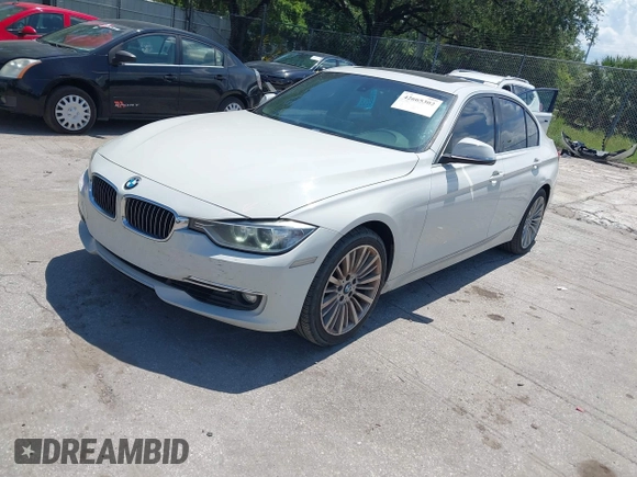 2014 BMW 3 Series 328i with VIN WBA3A5C54EP600398, listed as a IAAI auction lot 42665302 with 117,012 mi miles and . Bid and sale history available at DreamBid. Image 2.