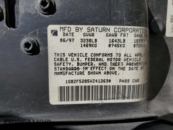 1997 Saturn SL with VIN 1G8ZF5285VZ412630, listed as a Copart auction lot 74937694 with 165,371 mi miles and Salvage Title. Bid and sale history available at carsss.com. Image 14.