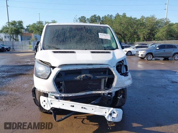 2021 Ford Transit Cargo with VIN 1FTBR1Y82MKA53386, listed as a IAAI auction lot 42058972 with 98,677 mi miles. Bid and sale history available at carsss.com. Image 6.