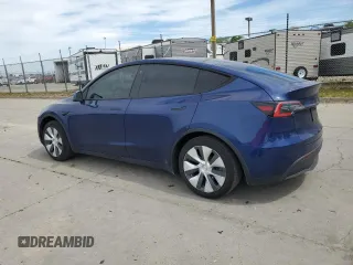 2021 Tesla Model Y Long Range with VIN 5YJYGDEE3MF094165, listed as a Copart auction lot 52907835 with 141,260 mi miles and Salvage Title. Bid and sale history available at DreamBid. Image 2.