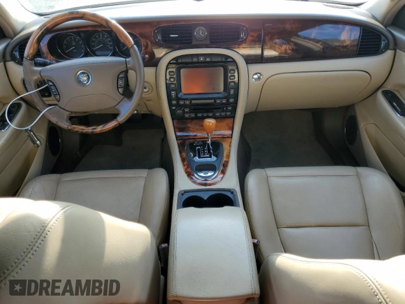 2005 Jaguar XJ with VIN SAJWA79C15SG48962, listed as a Copart auction lot 75674034 with 0 mi miles and Salvage Title. Bid and sale history available at carsss.com. Image 8.