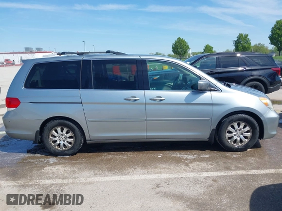 2010 Honda Odyssey EX with VIN 5FNRL3H44AB059711, listed as a IAAI auction lot 42057760 with 225,486 mi miles and . Bid and sale history available at DreamBid. Image 13.