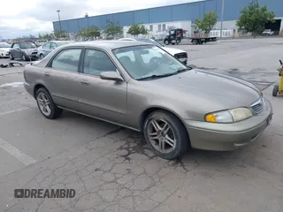 1999 Mazda 626 ES with VIN 1YVGF22C8X5900510, listed as a IAAI auction lot 41479213 with 178,182 mi miles. Bid and sale history available at carsss.com. Image 1.