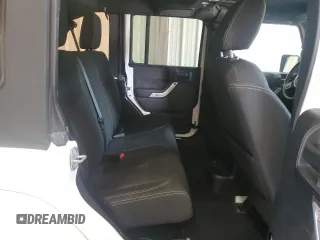 2016 Jeep Wrangler Unlimited Sahara with VIN 1C4BJWEGXGL310499, listed as a Copart auction lot 59756015 with 128,498 mi miles and Salvage title. Bid and sale history available at DreamBid. Image 10.
